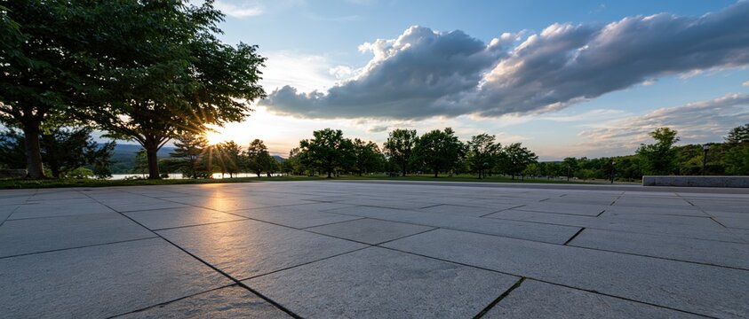 The Paved Plaza at Sunset with Long Shadows and Reflective Water