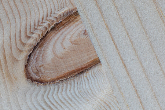 U-shaped knot on a flat wood surface