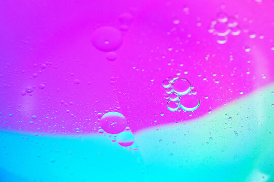 Fluid separation with colored background and many small bubbles