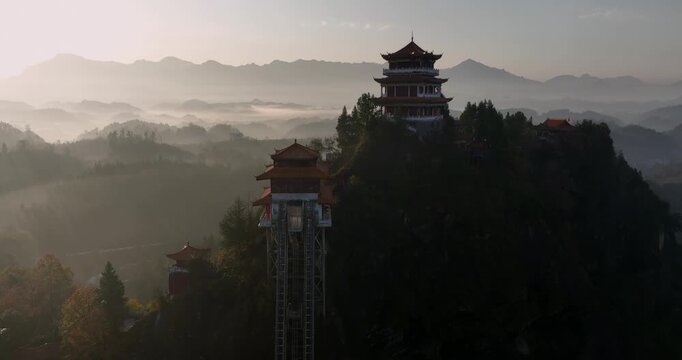 Sunrise and ancient chinese buddha temple landscape in Hunan province,China	