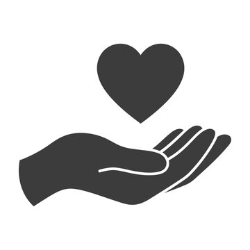 Hand holding heart symbol charity love kindness