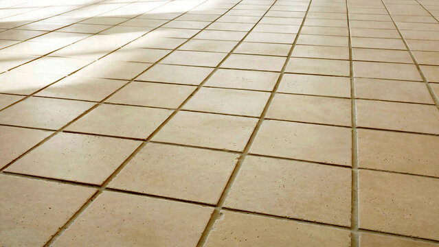 Neatly Laid Light Beige Ceramic Floor Tiles Pattern