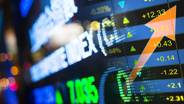 Financial market volatility and digital stock trading trends, global corporate investment and equity economy prediction. Close-up of financial stock market electronic ticker display board showing 