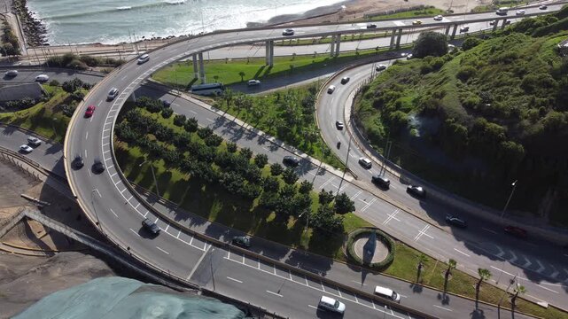 High angle perspective of vehicles driving on the coastal circuito de playas highway in lima, peru