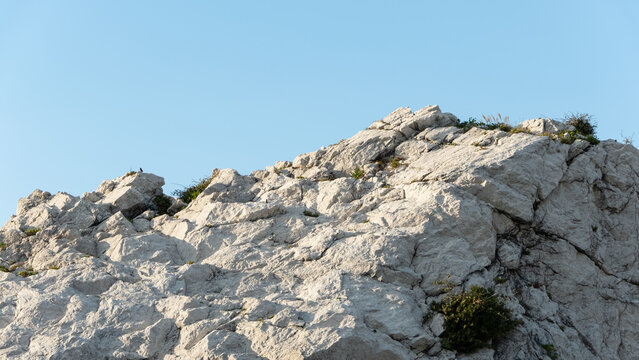 Magnificent white limestone rock formation standing under clear blue sky at Shirasaki Ocean Park in Wakayama Japan