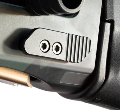 Close up of an extra large bolt release on a tactical shotgun