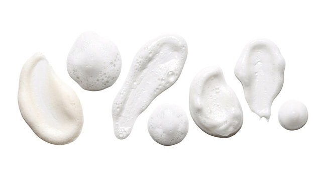 White cosmetic cream smears set on transparent background.