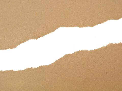 Torn brown kraft paper revealing white space background. Blank ripped cardboard sheets with rough edges for design frame, message note, template border, craft texture, and banner copy space