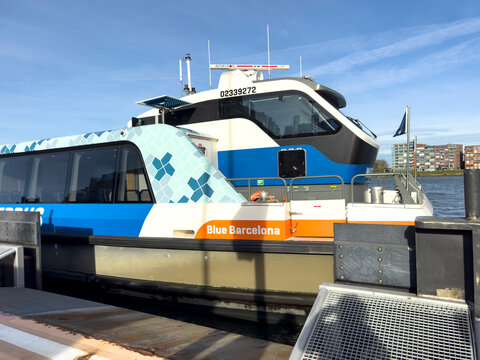 Dordrecht, Netherlands - 12 November 2025: Waterbus ferry arriving and docking in Dordrecht, preparing to pick up passengers along the river quay, showcasing efficient public water transport.