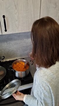 Cooking pumpkin on the stove in a kitchen