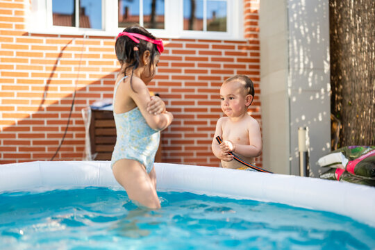 Girl Jumping Into Backyard Pool