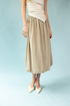 Crop View of Model in White Camisole and Beige Balloon Skirt