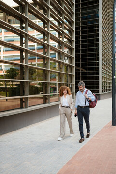 Colleagues meeting outside the office for a walk