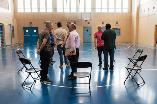 Diverse men meeting in a circle formation