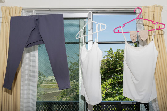 Laundry Drying Indoors Near Apartment Window