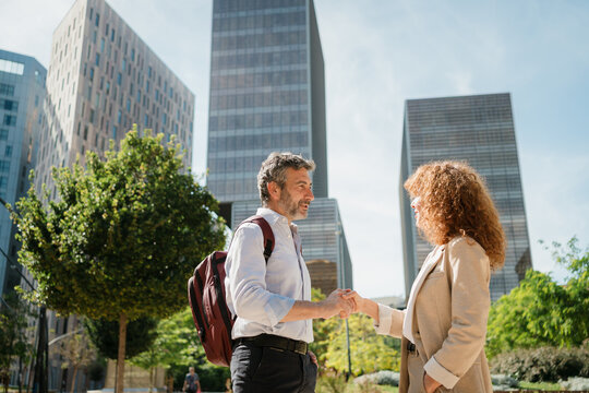 Business Partners Greeting Each Other with a Handshake in Urban Park