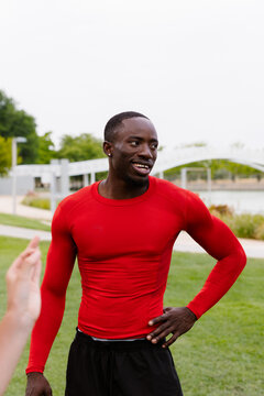 Portrait of an athletic Black man, posing in a relaxed manner