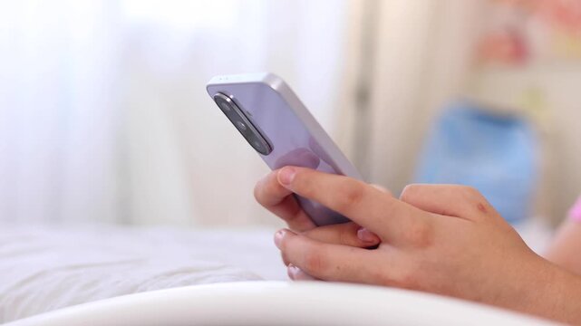 Close up of a woman using a smartphone for communication, browsing, social media, online activities and digital interaction.