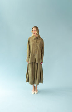 Full Length Portrait of Blonde Model in Olive Shirt and Balloon Skirt