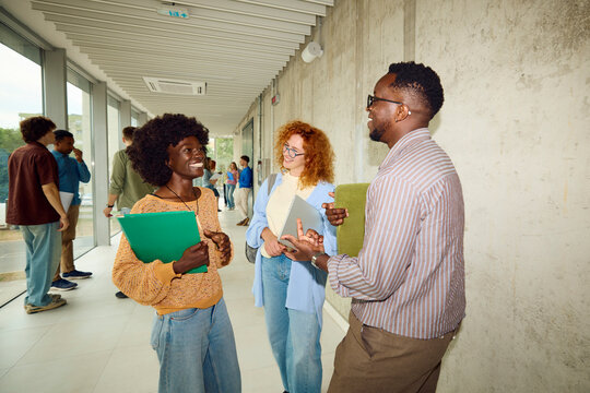 Classmates chat in a Modern University Building 