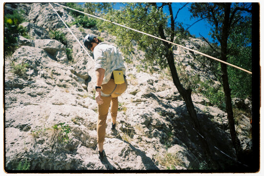 Climber Ascends Rock wall