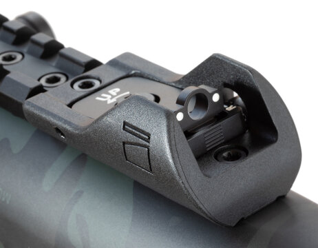 Ghost ring rear sights on a shotgun with two white dots