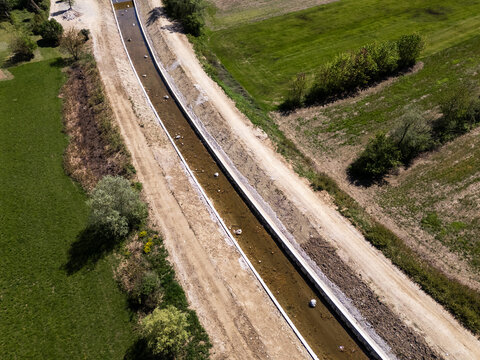 Drone view of a river restoration area showing cleaning and widening work for flood prevention and protection.