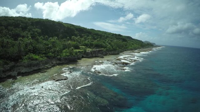 Aerial drone footage, island coast, Rota, Mariana Island