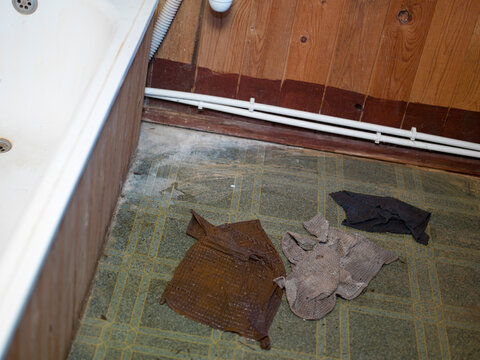 cleaning a wet floor due to a water leak
