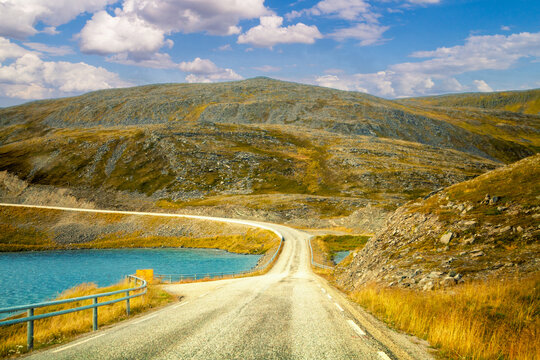 Driving a car on road in tundra. Nature of Norway. Polar circle. The way to Nordkapp