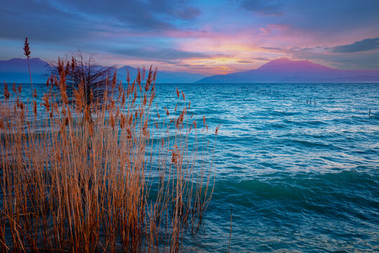 Early morning, sunrise over the lake.  Garda lake (Lago di Garda), Italy, Europe
