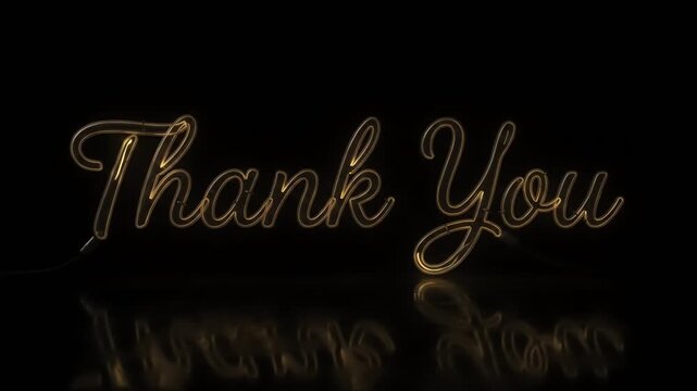 Elegant gold cursive thank you text isolated on a black background.