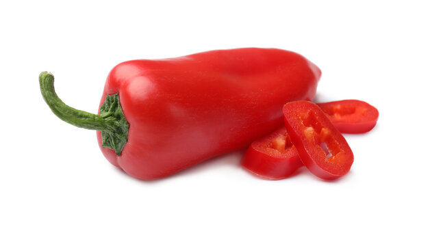 Whole and cut jalapeno peppers isolated on white
