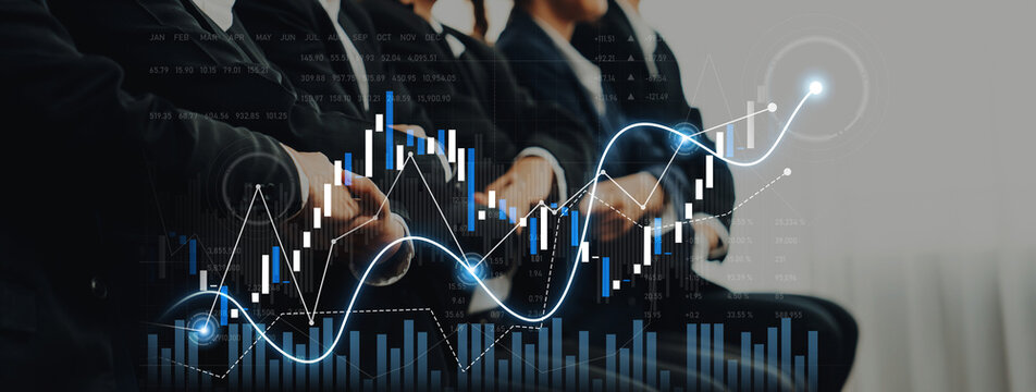 A group of business professionals seated in a conference setting, with digital graphics of stock market trends, symbolizing financial growth and strategic investment opportunities. Scalp