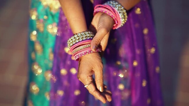 Indian Woman Hands with Traditional Henna and Colorful Bangles