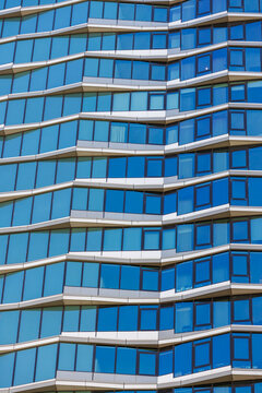 View of layered balconies and blue windows on a Sydney facade