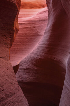 Beautiful vertical abstract texture of sandstone wave slot canyon under ambient light