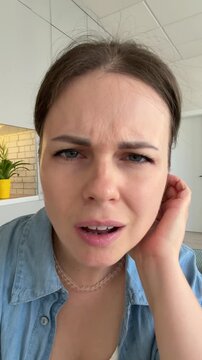 Confused young woman leaning forward then having a sudden realization and happy aha moment, 4k vertical