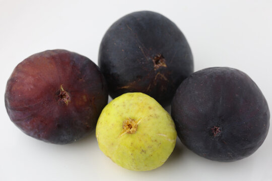 Fresh Ripe Black and Green Yellow Figs Isolated on White Background