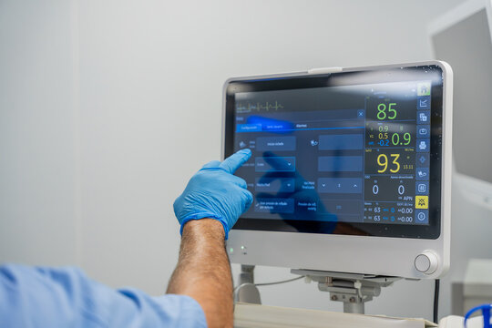 Medical professional operating patient monitoring system in hospital