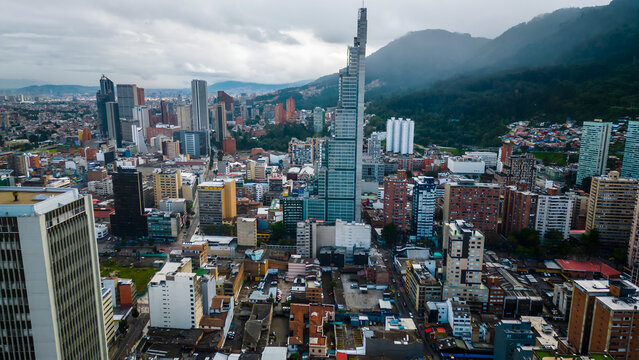 Aerial view of the BD Bacata skyscraper rising above the dense urban landscape of Bogota, Bogota, Colombia.