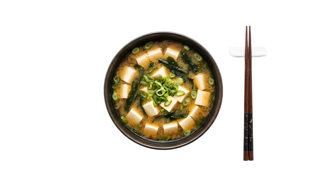 Top view of Japanese miso soup with tofu and chopsticks on white
