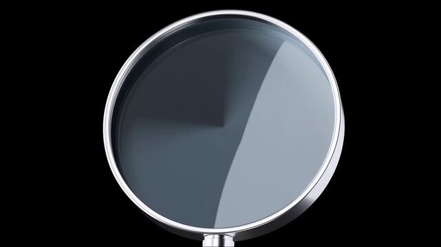 Black frying pan with reflective interior isolated against a dark background
