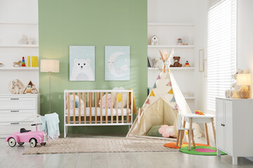 Spacious baby room with different furniture and toys. Interior design © New Africa