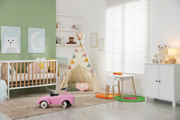 Spacious baby room with different furniture and toys. Interior design © New Africa