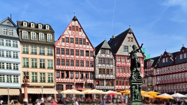 Frankfurt am Main, Germany - Historic half-timbered houses and Fountain of Justice on R&ouml;merberg square on a sunny day in summer