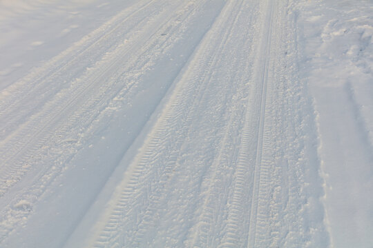 Snowy path with clear, parallel tracks