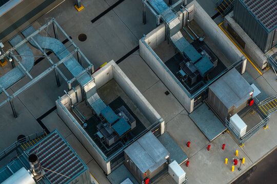 Aerial view of data center critical power backup distribution infrastructure featuring industrial generators, metal ducting, and concrete enclosures in Poland.