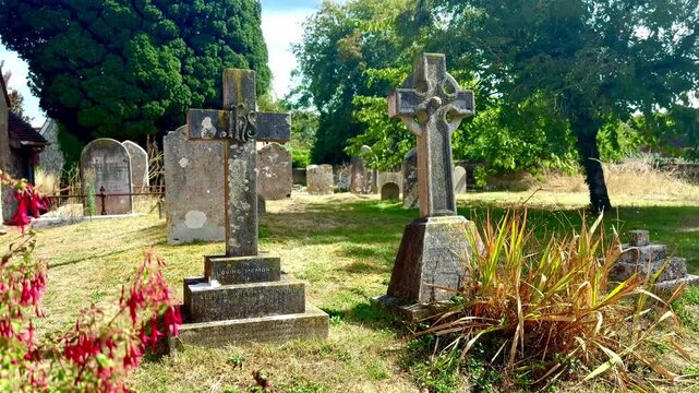 Piddinghoe, East Sussex - August 28th 2026: graveyard with tombstones beside St John's Church