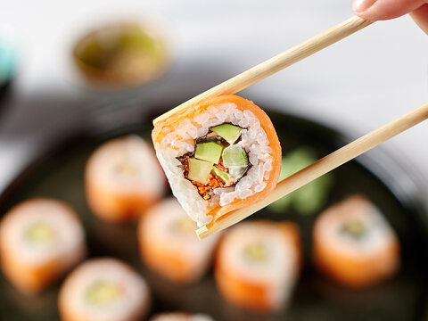 Closeup of a Japanese roll with salmon. Selective focus.